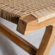 Reclining armchair in natural wood and woven rattan