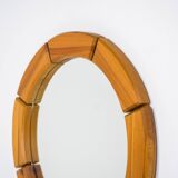Sculptural wall-mirror in solid pine