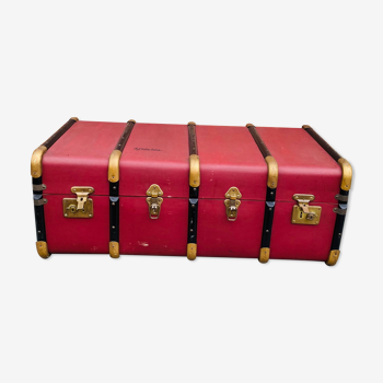 Old travel chest in burgundy leather