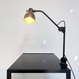 Industrial in height to be adjusted vintage clamp lamp from the 1970s