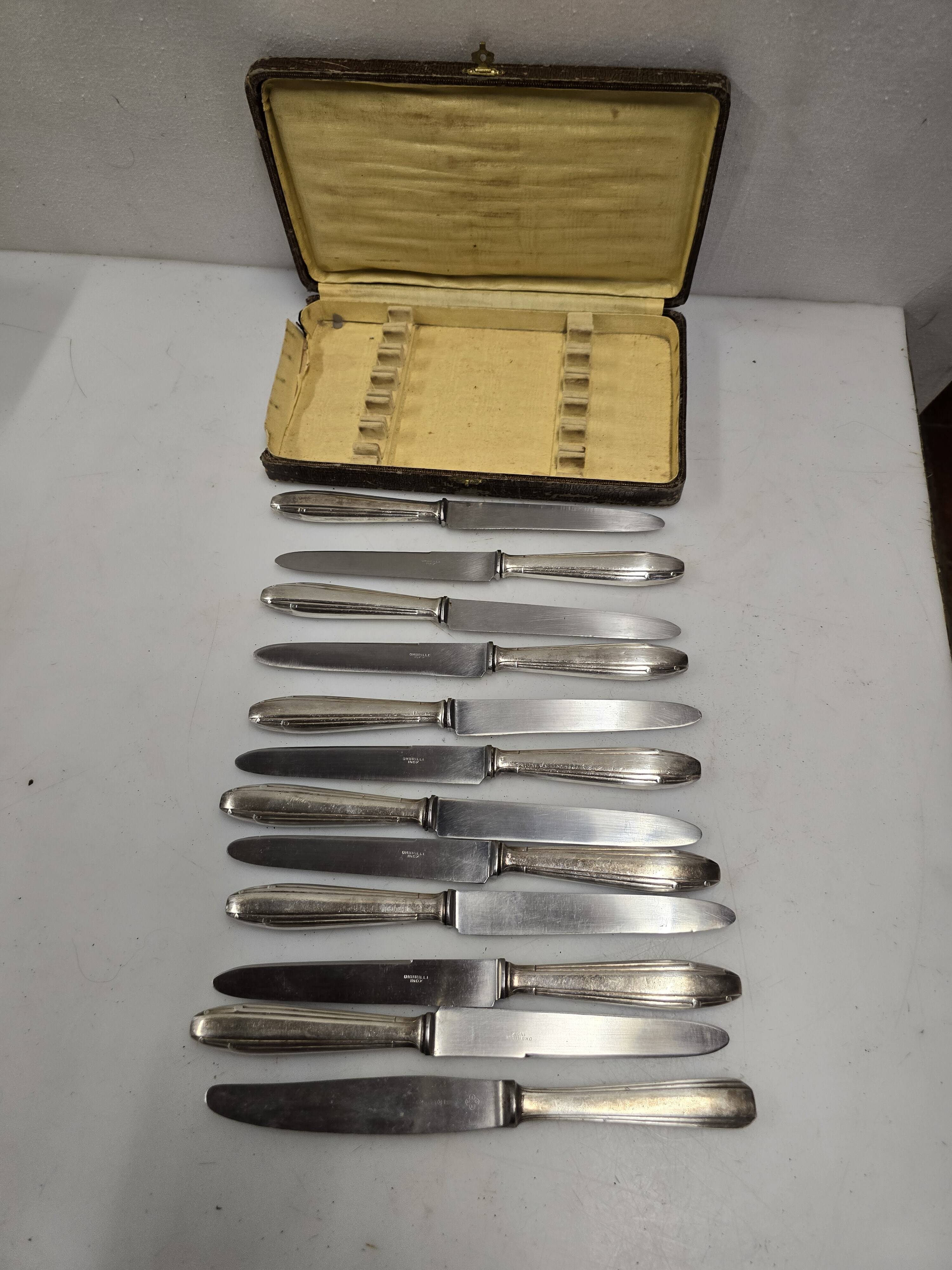 12 silver-plated knives from the mid-20th century