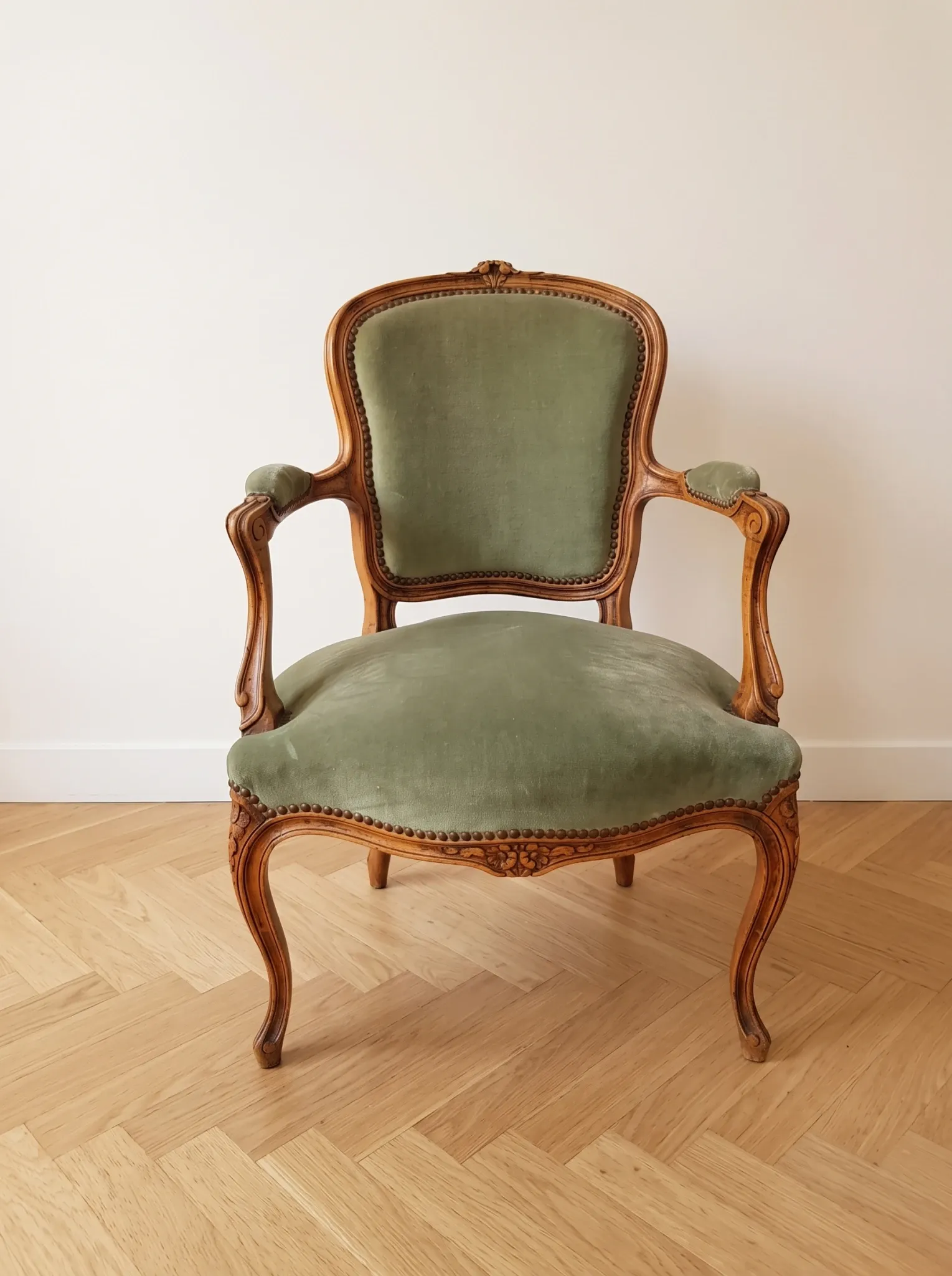 Pair of cabriolet armchairs in Louis XV style in green velvet.