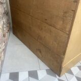 On a piece of furniture with sorting lockers and drawers