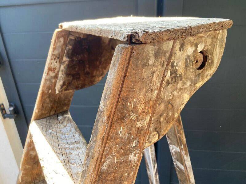 Antique authentic painter's stepladder in vintage patinated wood