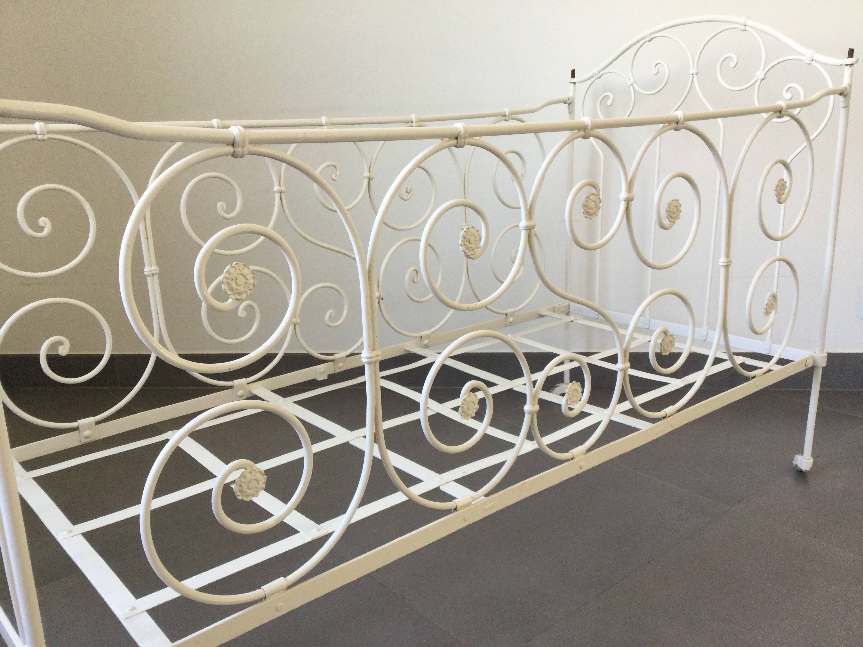 White wrought iron folding bed