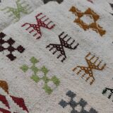White carpet with multicolored Berber patterns handmade
