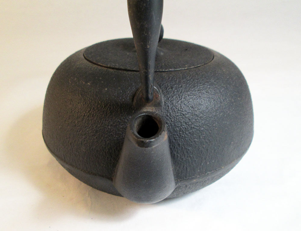 Black cast iron teapot