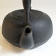 Black cast iron teapot