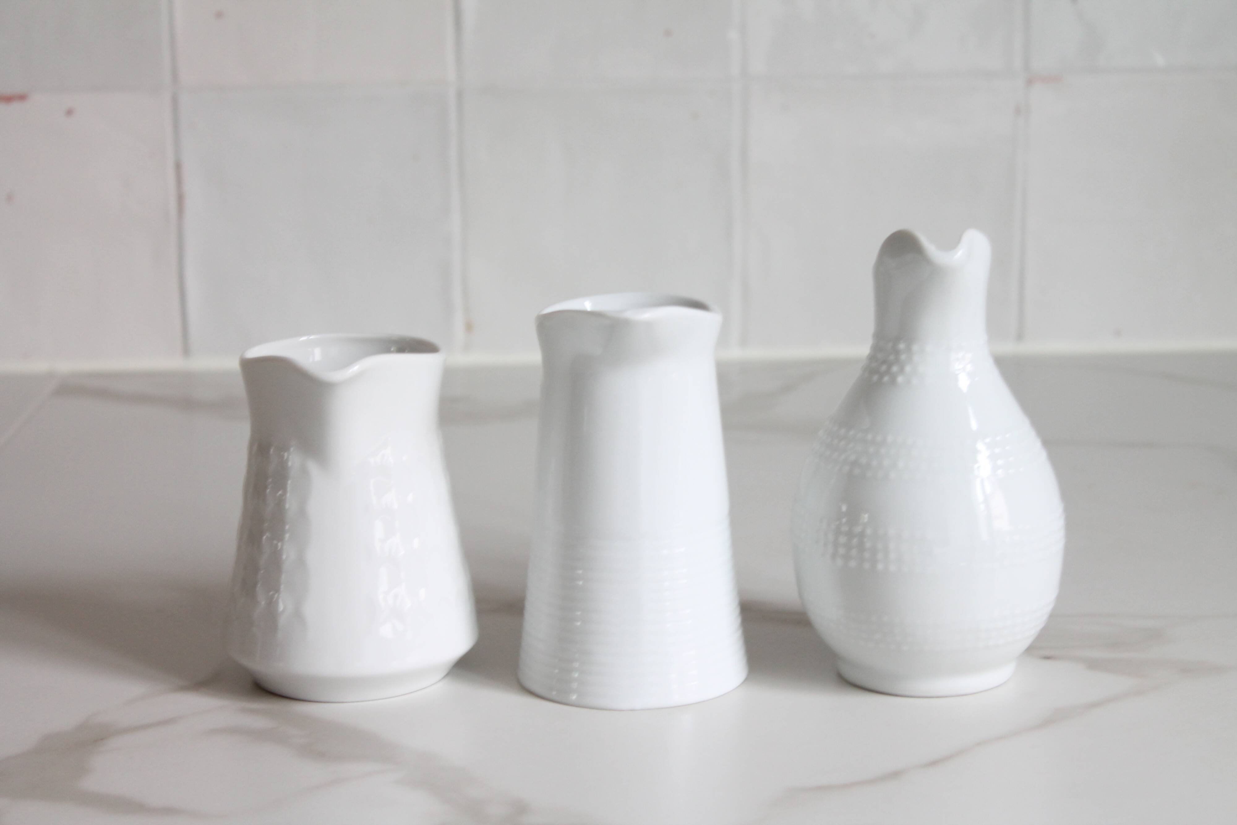 3 old French pitchers in white ceramic