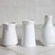3 old French pitchers in white ceramic