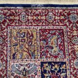 Vintage mechanical Turkish rug with box decoration on a red and navy blue background 139 x 68 cm