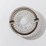 Vintage crystal glass ashtray from the 1920s, silver-edged with a textured pattern, Art Deco table decoration.