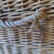 Wicker travel trunk XIX with metal clasps and handles.
