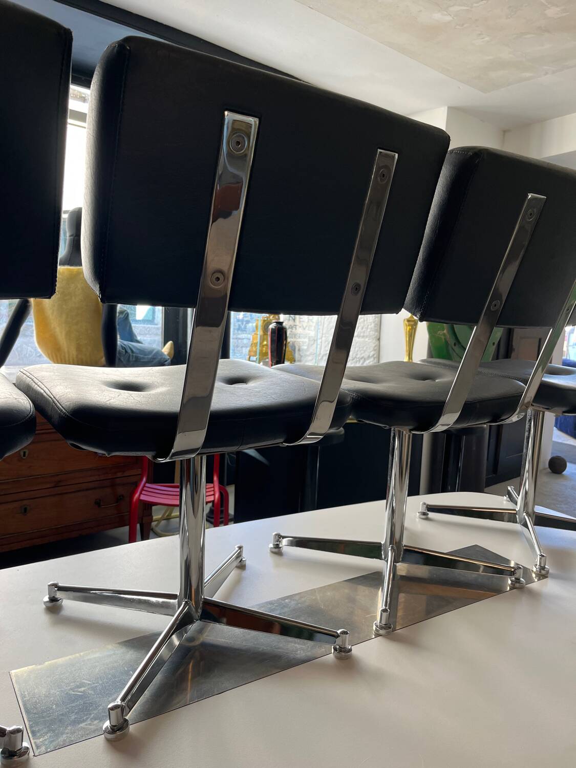 Metal chairs with black faux leather from the 1980s.