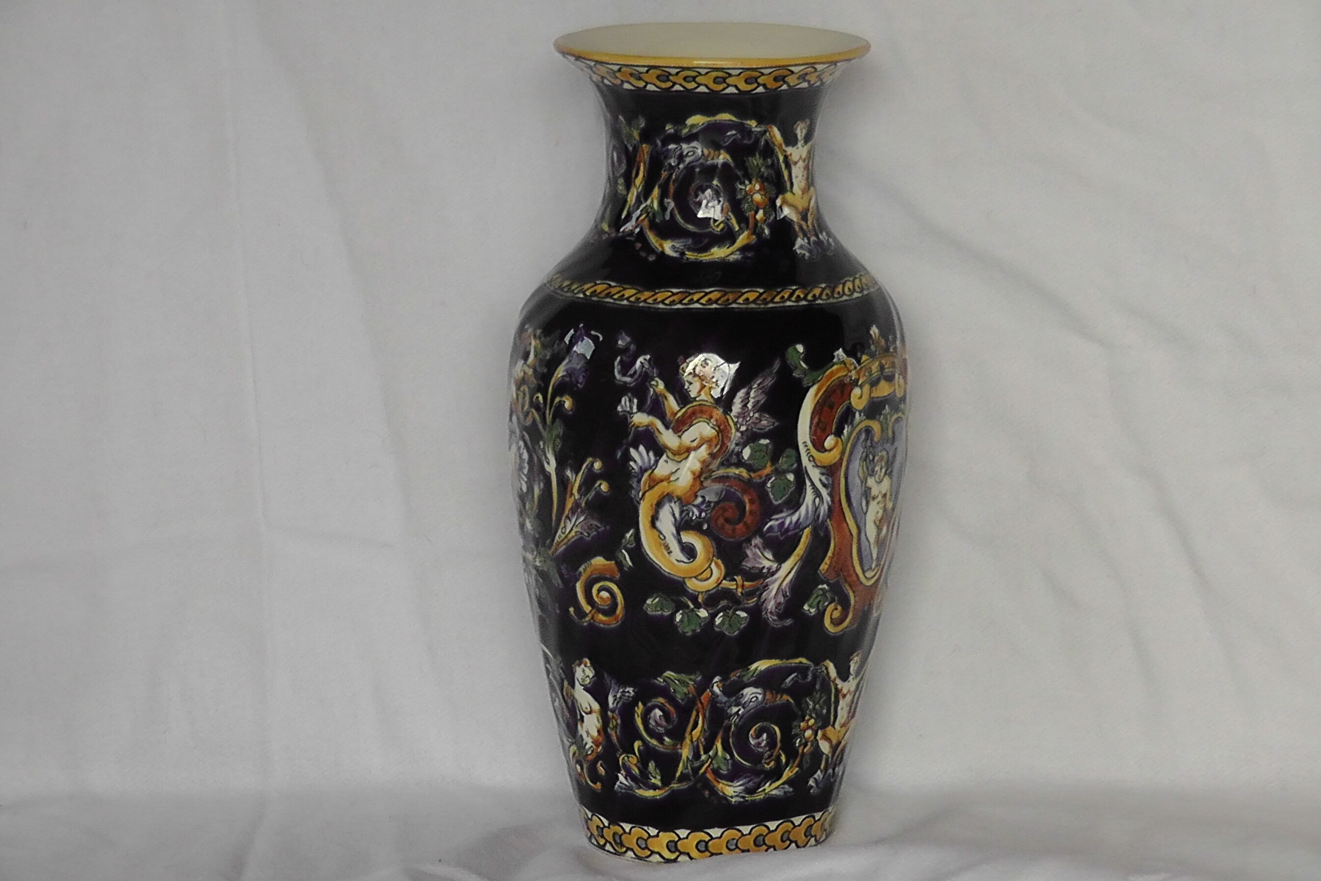 Gien earthenware vase on XX century blue background