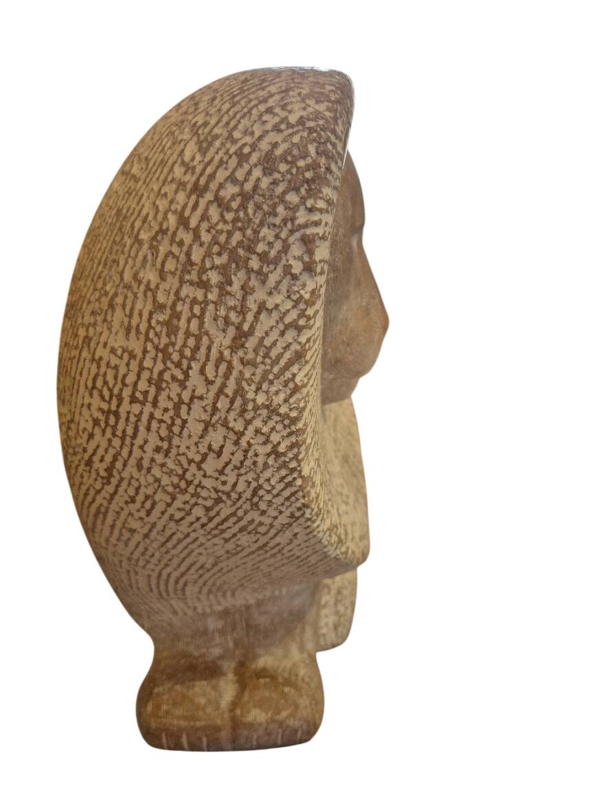 Sculpture of a lion in stone by Islay Grimes.