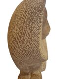 Sculpture of a lion in stone by Islay Grimes.