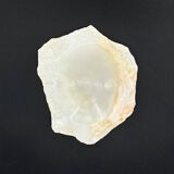 Empty pocket bowl made of translucent natural stone.