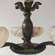 Art Deco bronze three-arm chandelier with marbled glass shades.