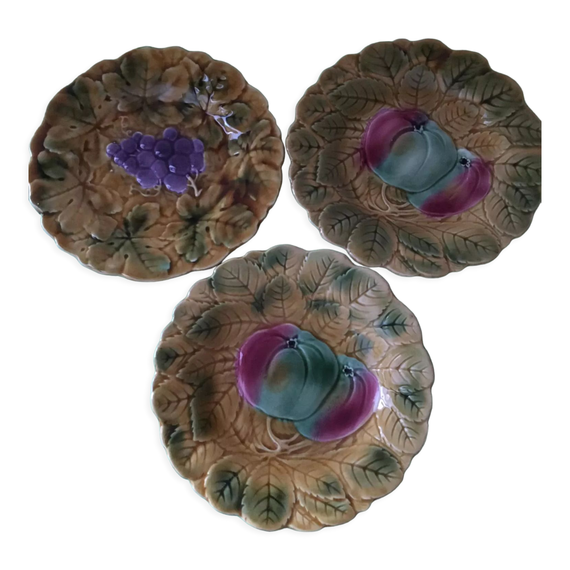 3 slip dessert plates stamped Sarreguemines. Fruit decor.