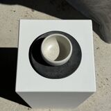 White Indonesian ceramic cup and gray saucer