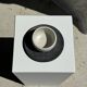White Indonesian ceramic cup and gray saucer