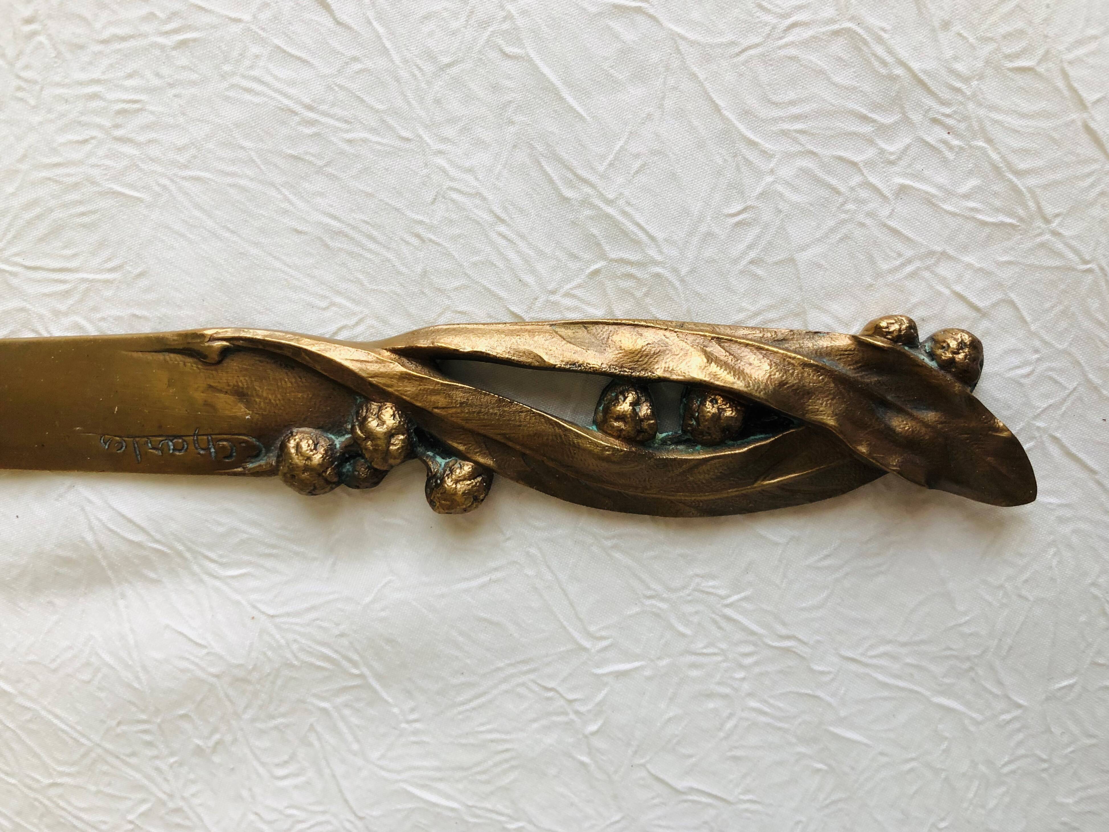 Opens letters cut bronze paper signed