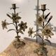 Pair of church candlesticks in bronze with floral decorations.
