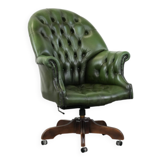 Large green cowhide Chesterfield office chair in English style on wheels