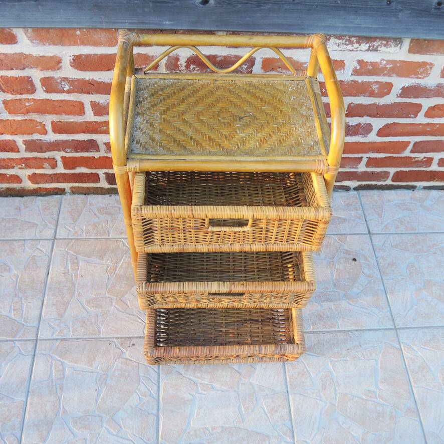Old chest of drawers with 3 bamboo and wicker drawers.
