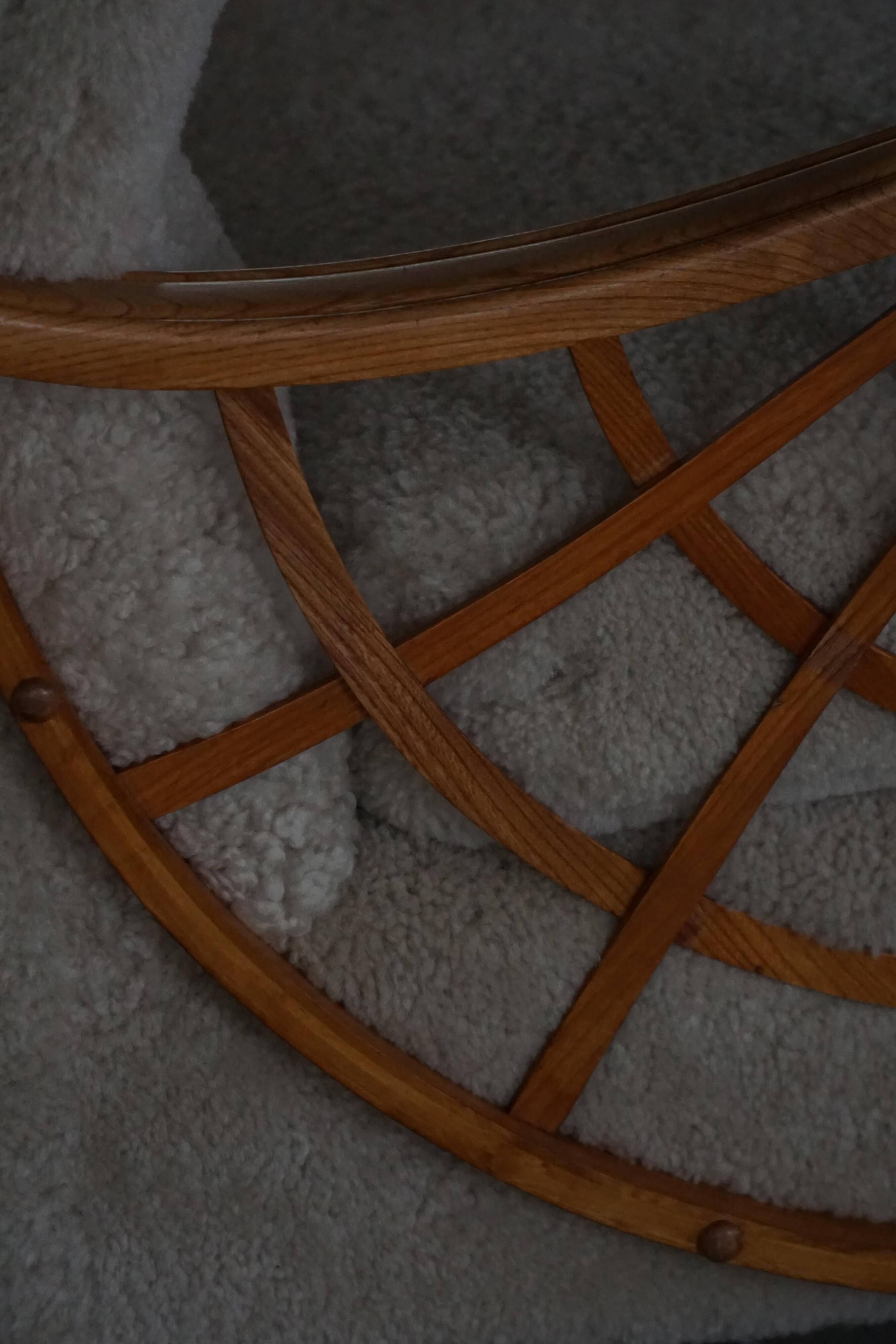 Pair of modern Swedish lounge chairs, shearling sheepskin and elm, 1940s.