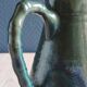 Vintage ceramic pitcher vase in glazed green and blue.