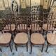 Suite de 8 chaises de bistrot en cannage FISCHEL