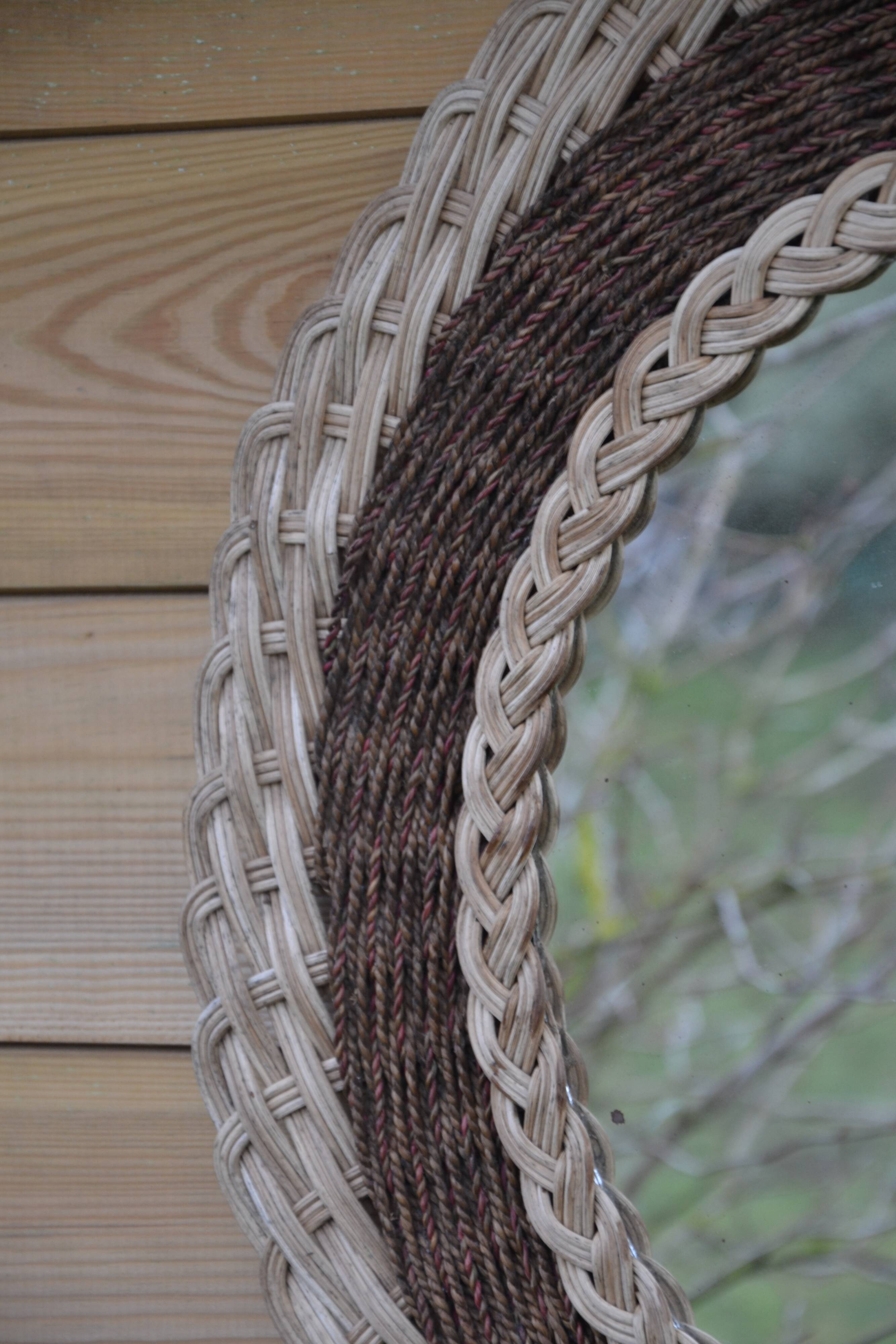 Round woven rattan mirror with rope from the 1970s.