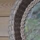 Round woven rattan mirror with rope from the 1970s.