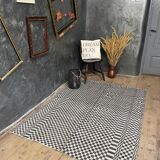 Romanian floral rug handwoven in wool, white and black background