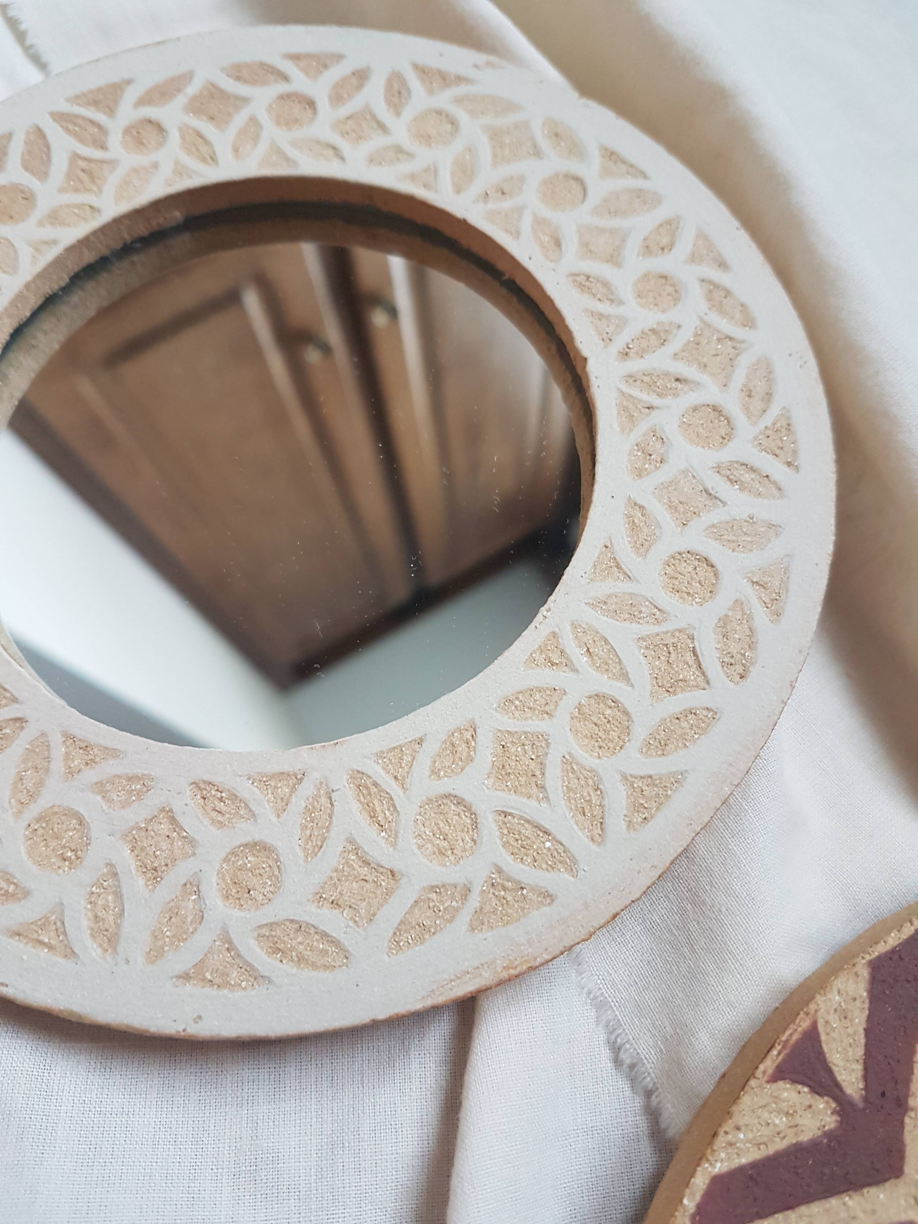 Stoneware mirror with sgraffito decoration