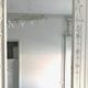 Louis XVI style mirror in wood and carved stucco 20th century