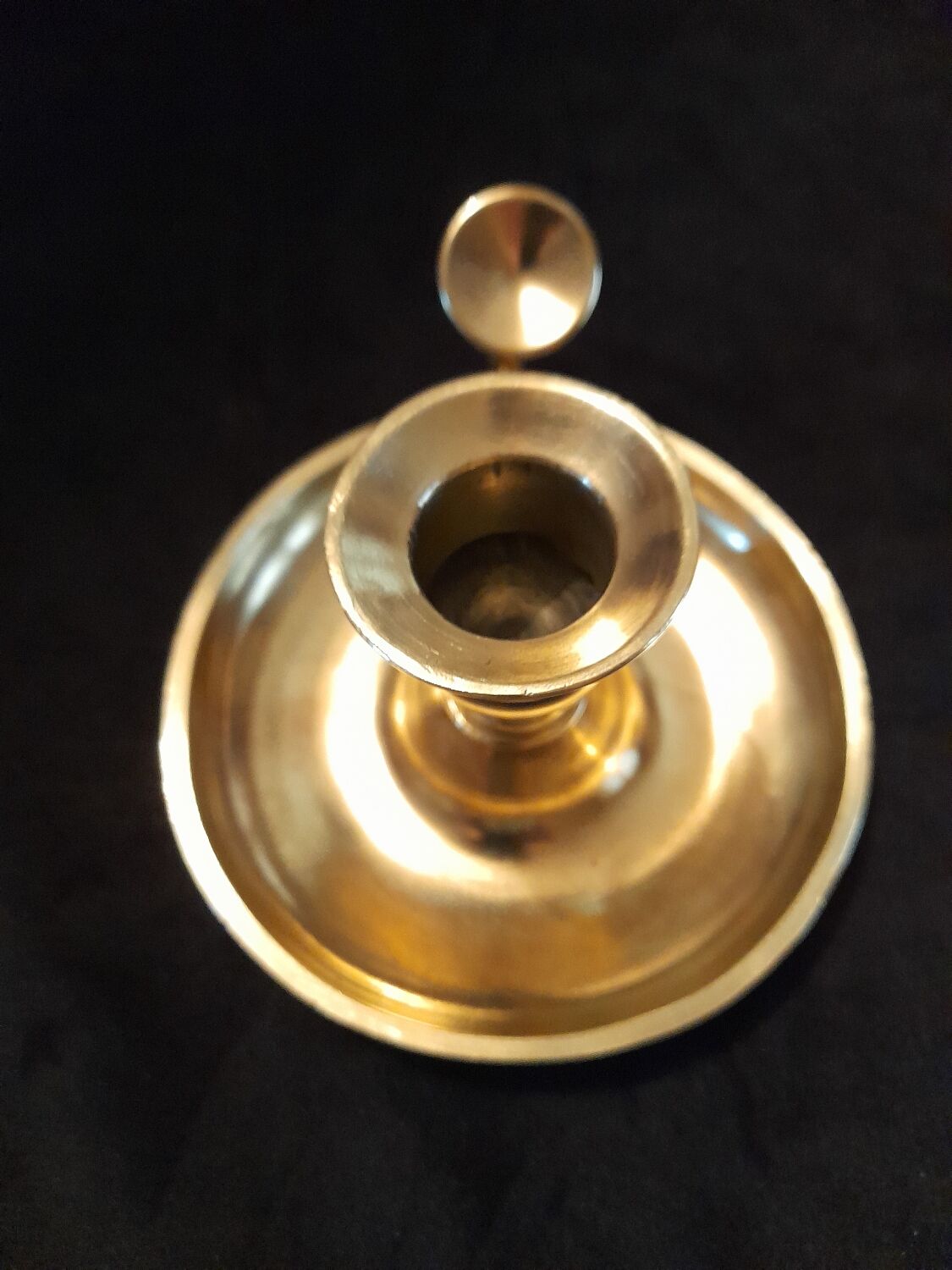 Tailed candle holder.