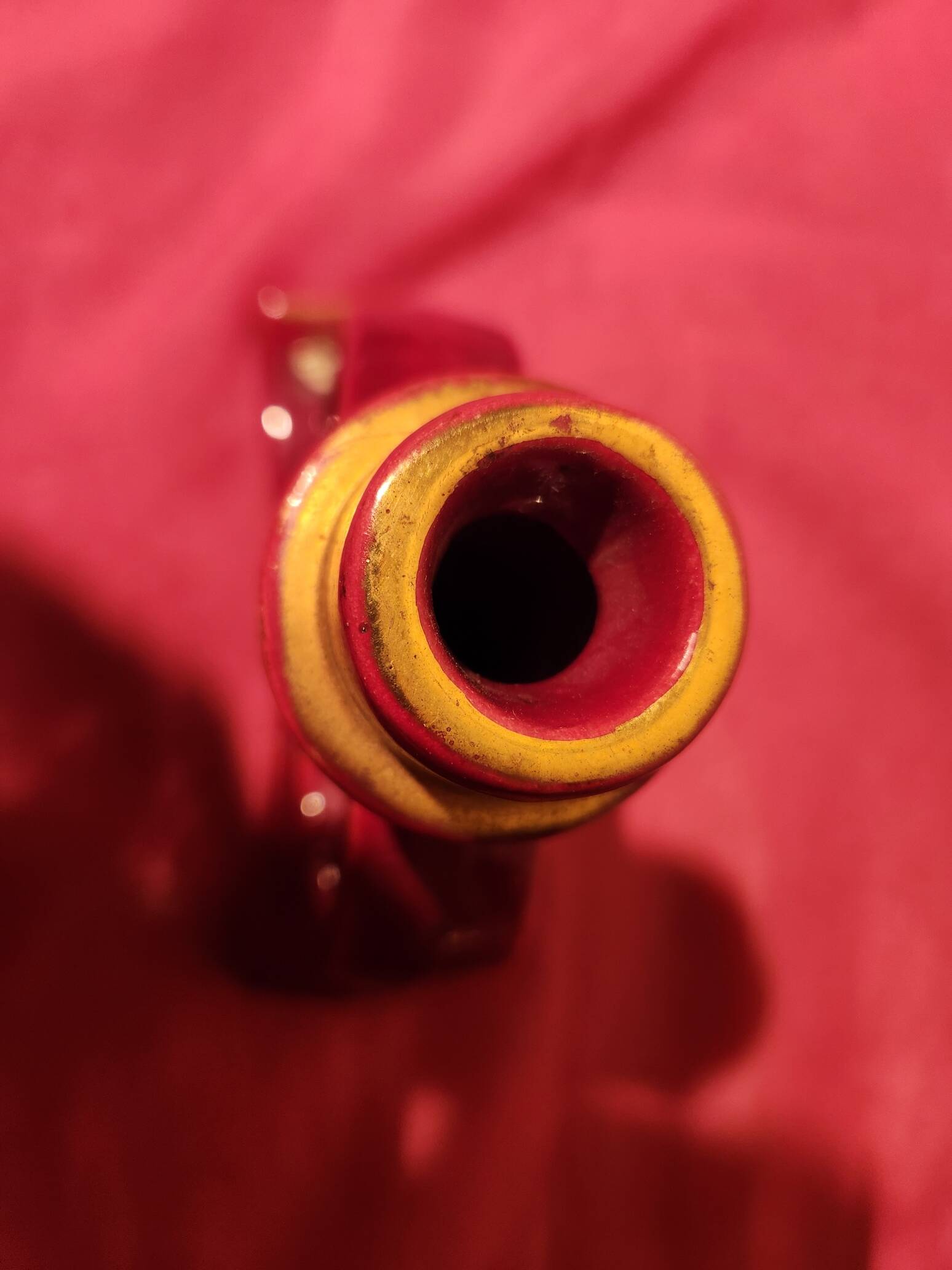 Pair of vintage ceramic candle holders, hand-painted in red and gold.