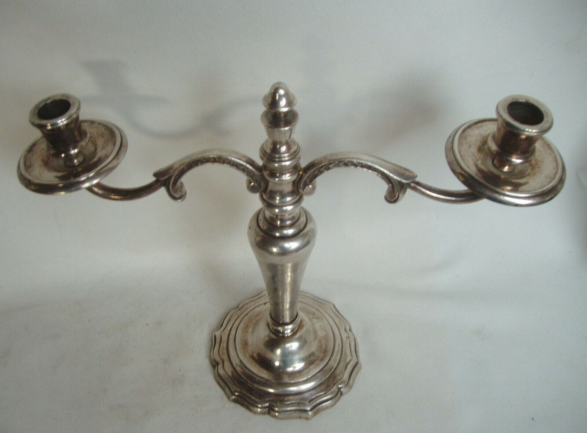 Two-branch silver-plated candle holder from the early twentieth century.