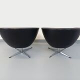 Pair of vintage Scandinavian swivel armchairs in faux leather and chrome.