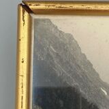 Photo in black and white mountain lake in golden frame