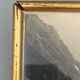 Photo in black and white mountain lake in golden frame