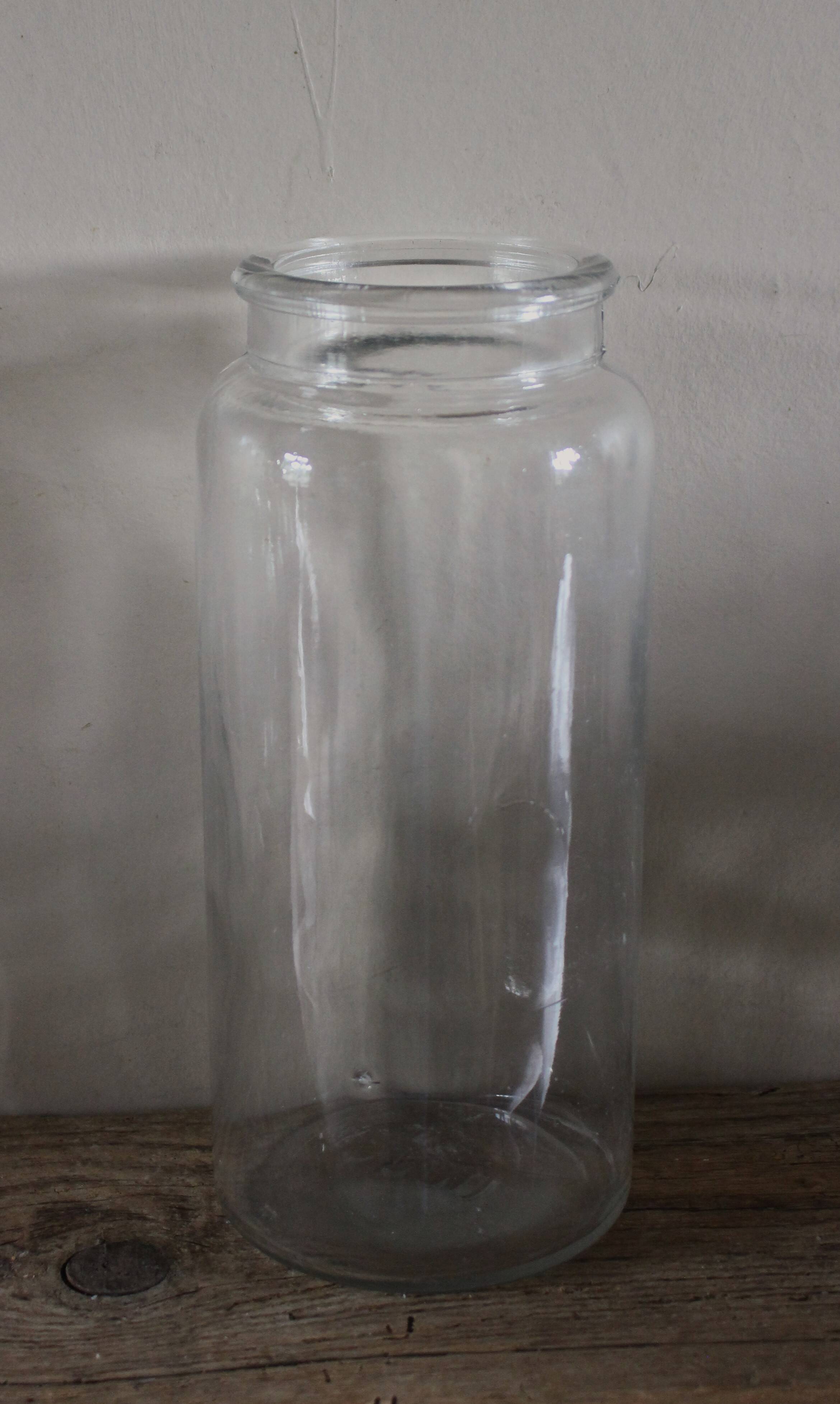 Large antique transparent glass bottle vase