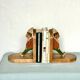 Old wooden bookends with painted characters