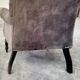 Buttoned armchair