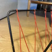 Vintage red and black scoubidou magazine rack, 1950s/60s