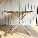 White folding metal bistro table