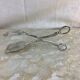 Old cutlery tongs
